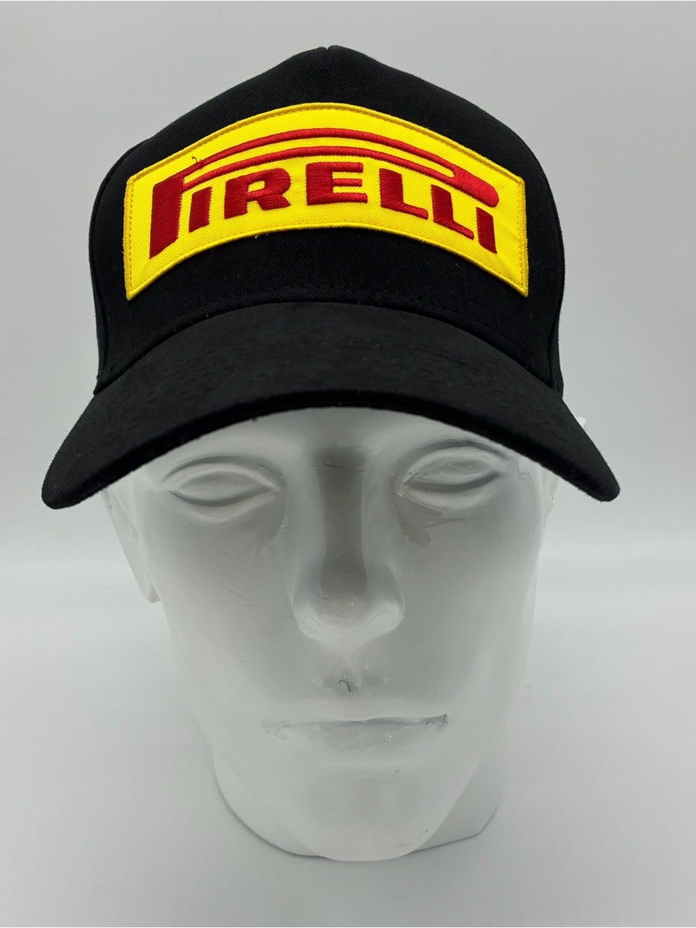Pirelli Black Cap with Yellow & Red Patch